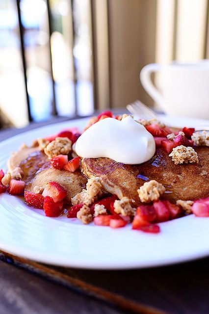 pancakes with strawberries, granola, and yogurt