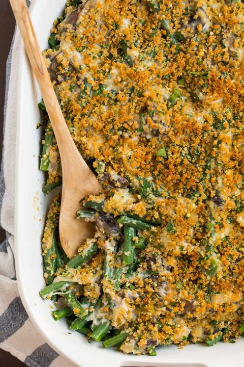 healthy green bean casserole with wooden spoon