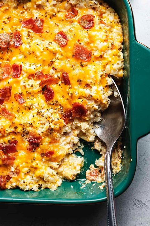 loaded cauliflower rice casserole with bacon and spoon