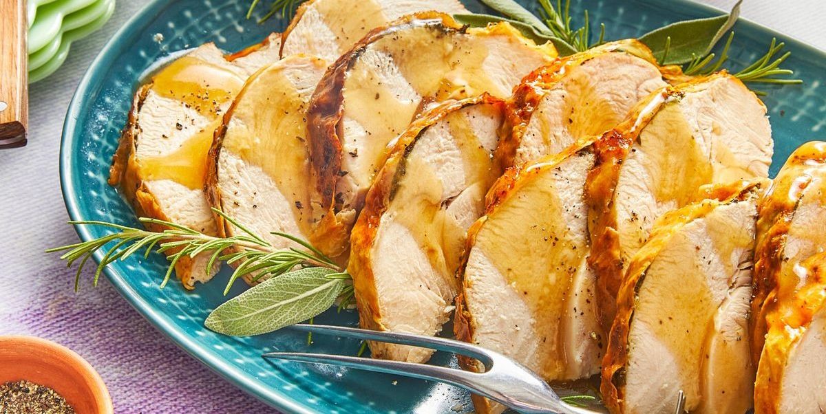 turkey breast with herbs on platter