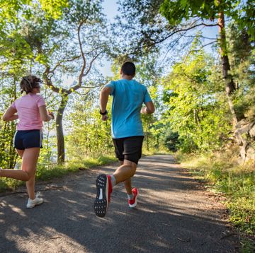 healthy couple jogging in nature.
