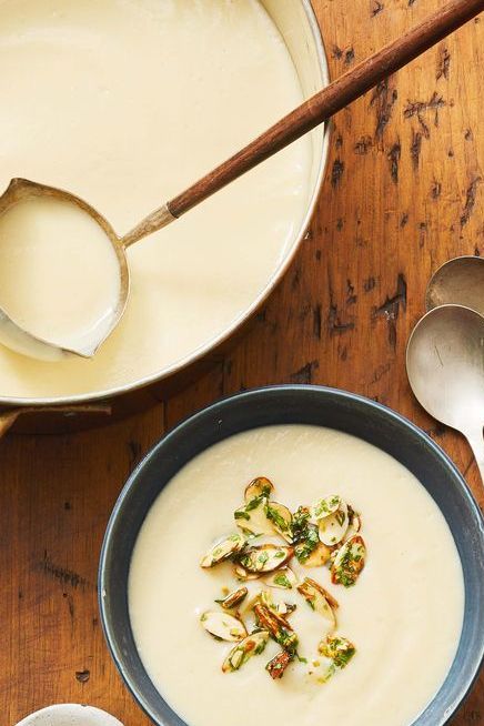 healthy cauliflower fall soup in a pot and bowl