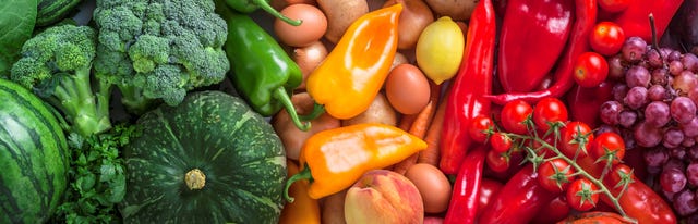 Fruits and vegetables overhead assortment on colorful background