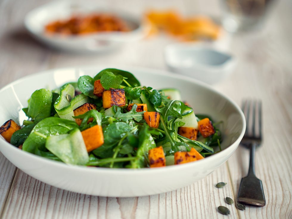 healthy green salad with roasted butternuts squash