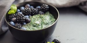 Healthy organic spirulina porridge topped with berries