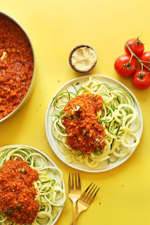 zucchini pasta with lentil bolognese yellow background