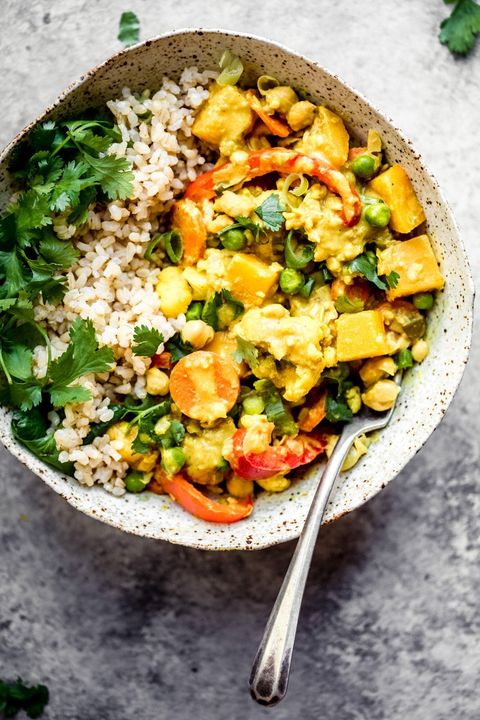 yellow chickpea pumpkin curry with rice and herbs