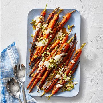 a plate of roasted carrots and a bowl of farro