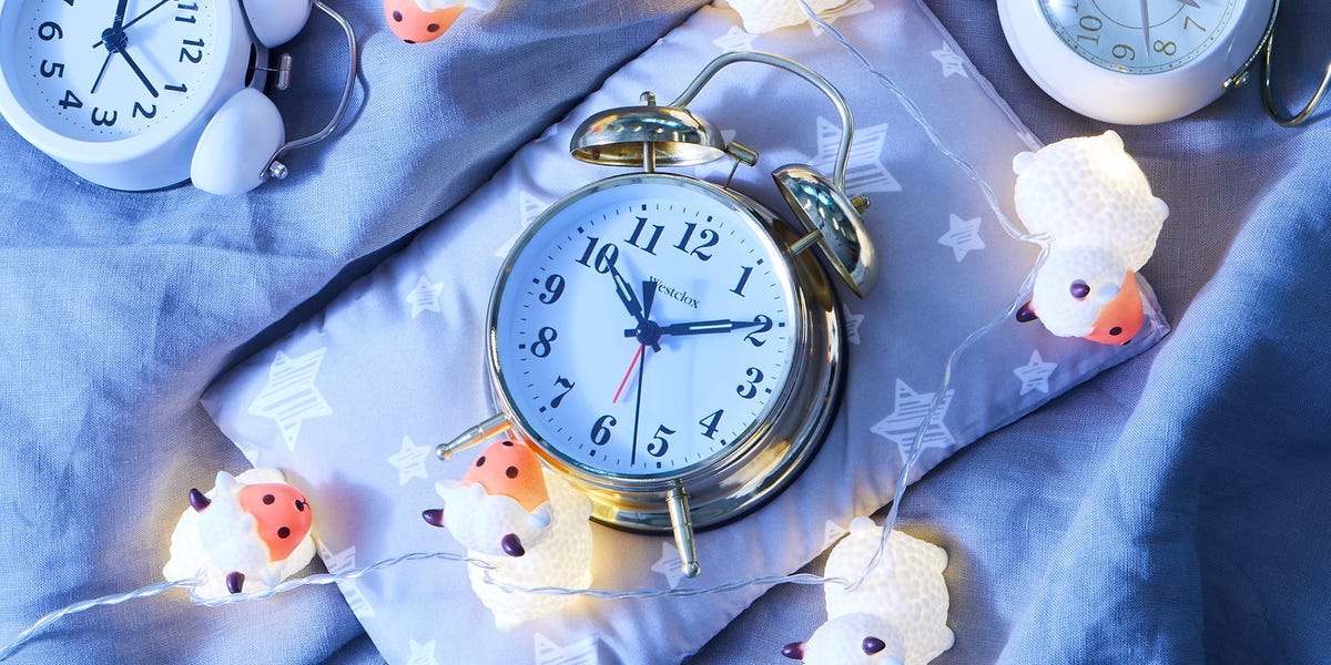 alarm clock on pillow with light up plastic sheep