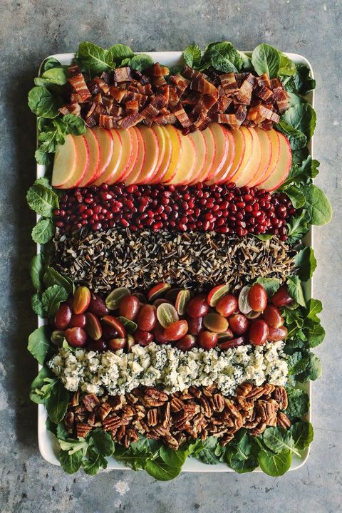 holiday wild rice salad in layers on platter