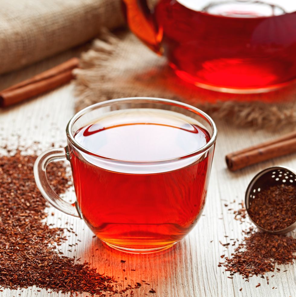healthy traditional herbal rooibos beverage tea with spices on vintage