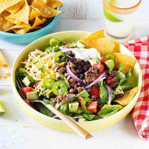 easy taco salad with chip in bowl and marg