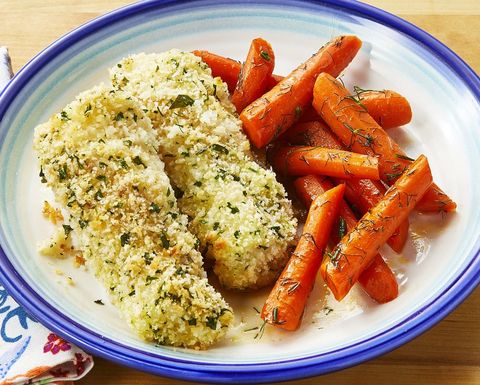 parmesan fish sticks with glazed carrots on white and blue plate