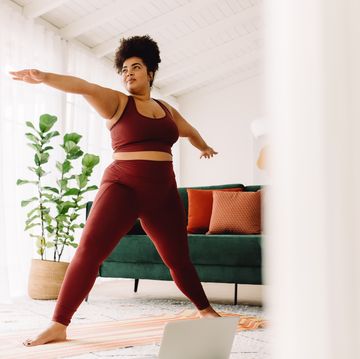 Young Adult Curvy Plus Size African American Woman Practicing Yoga