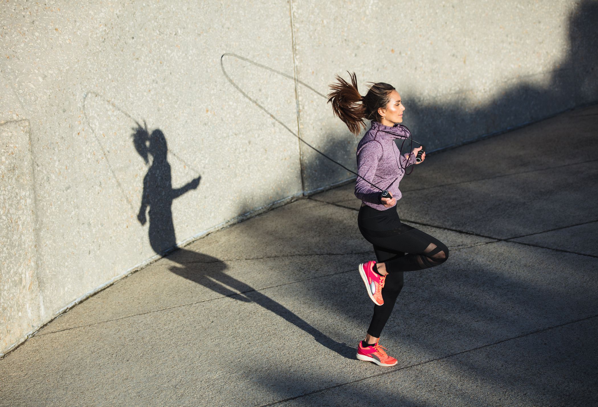 Female athletes show off their toned bodies as they stand back to back –  Jacob Lund Photography Store- premium stock photo