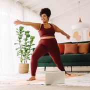 healthy woman training at home, yoga to boost heart health