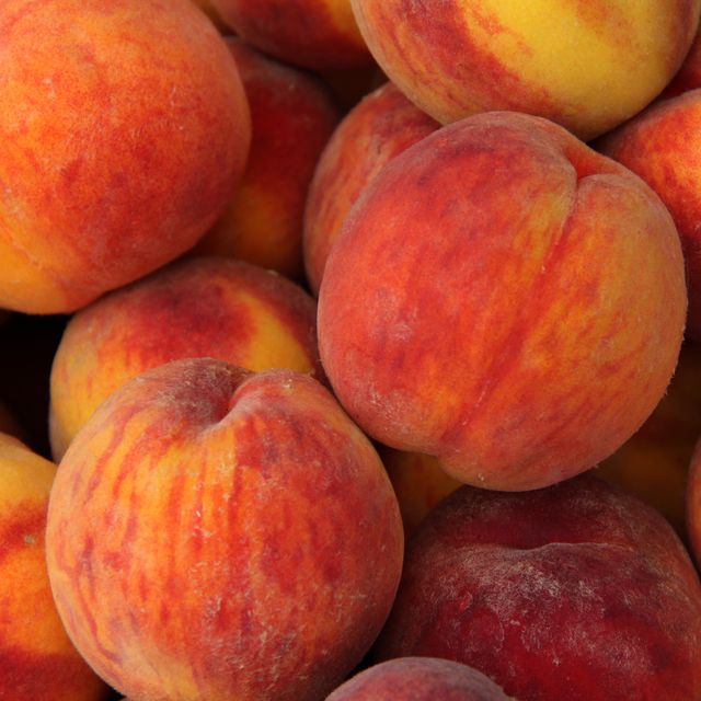a heap of ripe peaches prunus persica close up