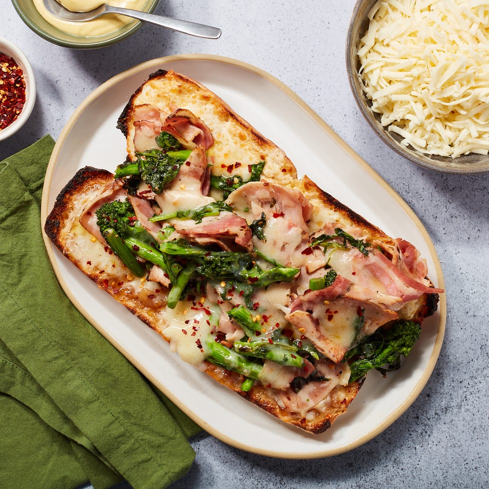openfaced sandwich topped with ham and vegetables