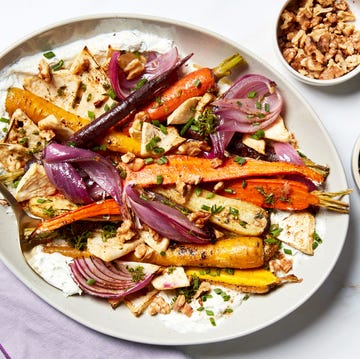 roasted vegetables with chicken and nuts on a serving platter roasted vegetables with chicken and nuts on a serving platter