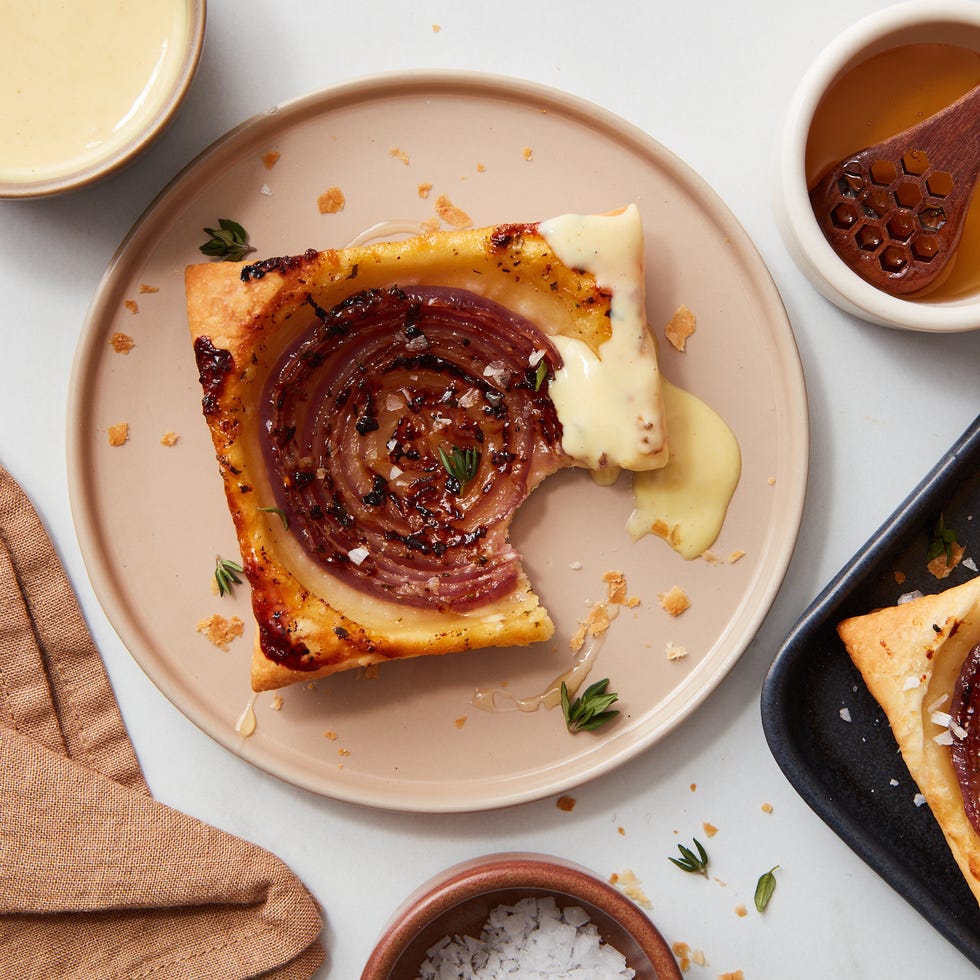 savory pastry with layers of meat and cheese served on a plate