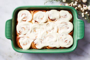 baking dish filled with frosted cinnamon rolls