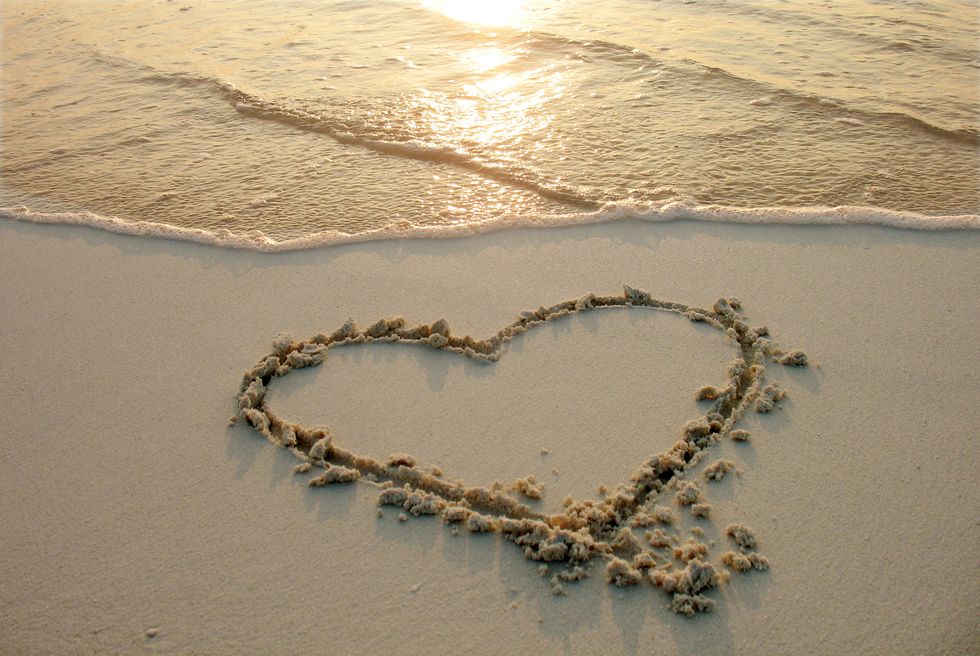 heart drawn on sand