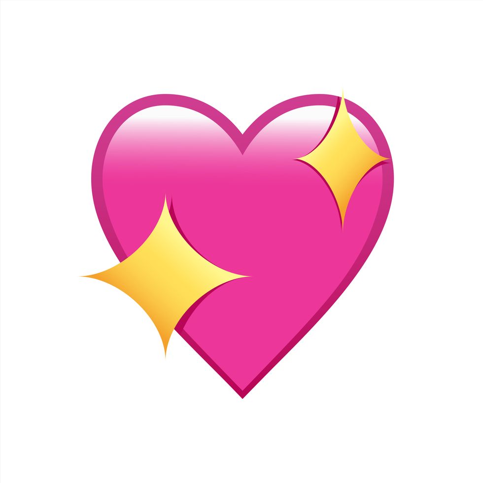 pink heart emoji with two sparkling stars on either side of the heart