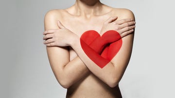 woman with painted heart on body, heart health concept