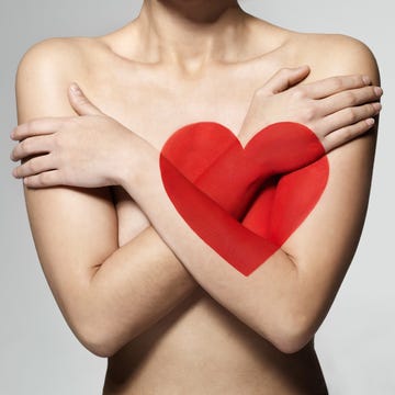woman with painted heart on body, heart health concept woman with painted heart on body, heart health concept