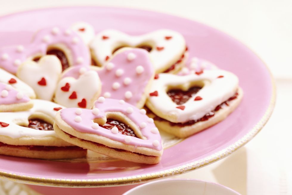 heart linzer cookies with cup of tea
