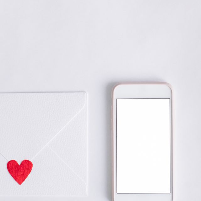Heart Shape Papers And Mobile Phone With Envelope Against White Background