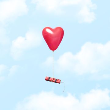 heart shaped balloon carrying a dynamite stick