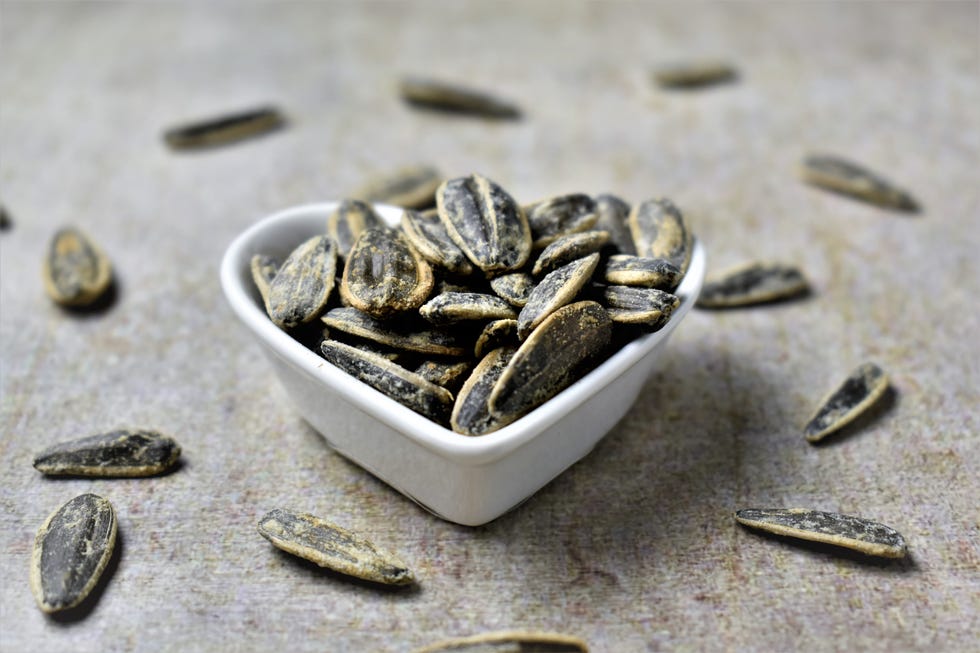 heart shaped bowl with salted sunflower seeds