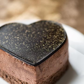 heart shaped chocolate mousse cake with gold flecks