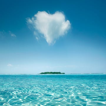 heart shaped cloud over tropical waters