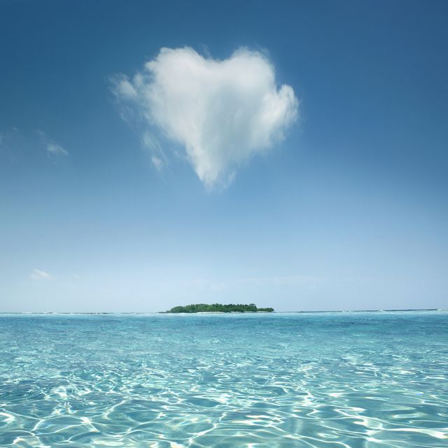 heart shaped cloud over tropical waters