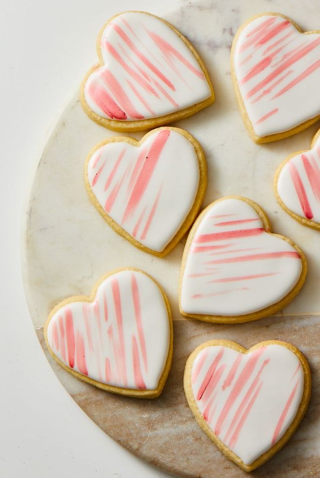 pink heart shaped cookies on a marble surface