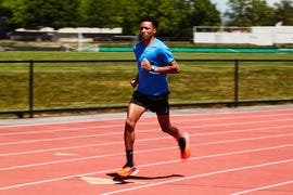 runner sprinting on track