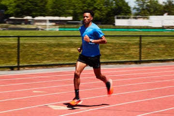 runner sprinting on track