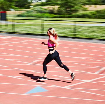 a woman running on a track