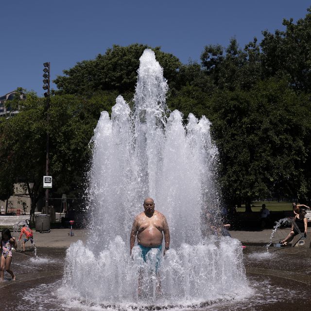 portland, or   june 27 pablo miranda cools off in the salmon springs fountain on june 27, 2021 in portland, oregon record breaking temperatures lingered over the northwest during a historic heatwave this weekend photo by nathan howardgetty images