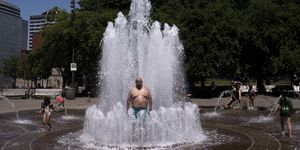 portland, or   june 27 pablo miranda cools off in the salmon springs fountain on june 27, 2021 in portland, oregon record breaking temperatures lingered over the northwest during a historic heatwave this weekend photo by nathan howardgetty images