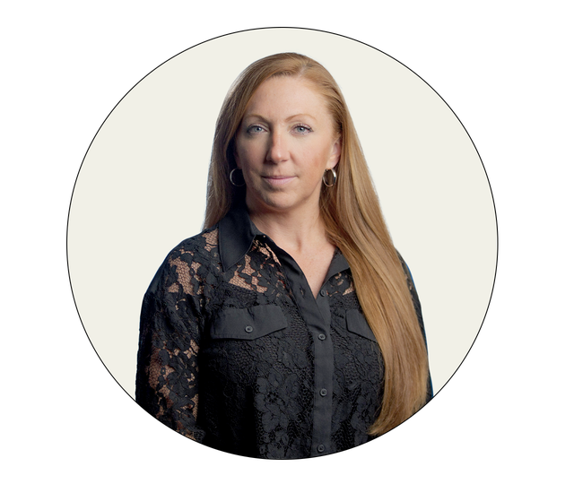 professional portrait featuring a woman in a black lace blouse