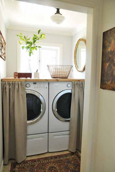 laundry room cabinet ideas with fabric covered washer and dryer