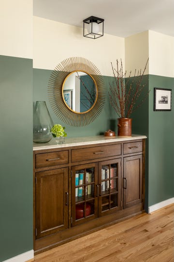 room with green and cream two tone wall
