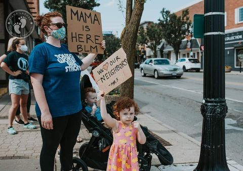 heather nye and her daughter at a black lives matter protest in toledo, oh ﻿