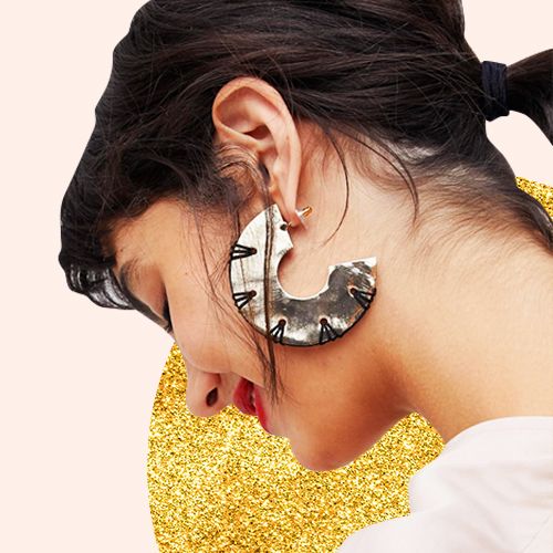 Ear, Face, Nose, Organ, Yellow, Neck, Fashion accessory, Close-up, Human body, Jewellery, 