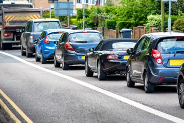 heavy traffic jam next to bus lane in england uk