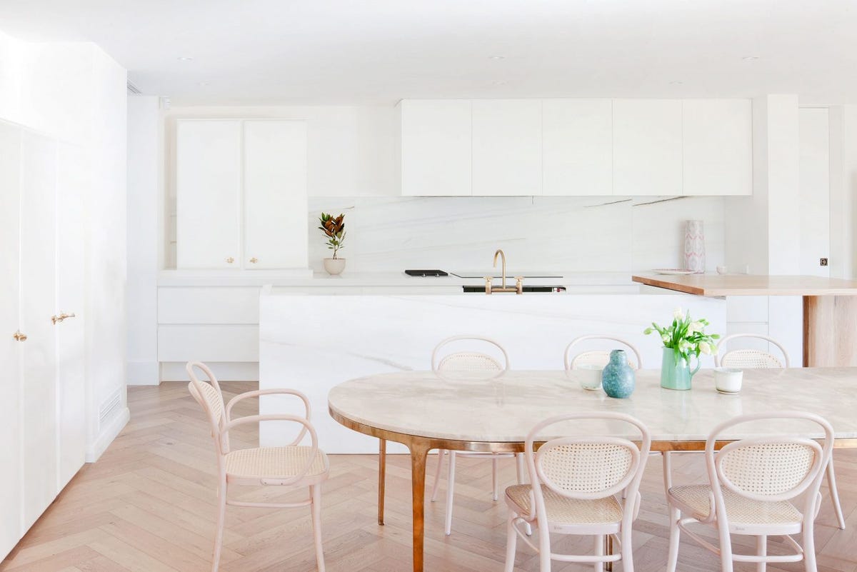 Copy space on white marble tabletop in beautiful pastel pink