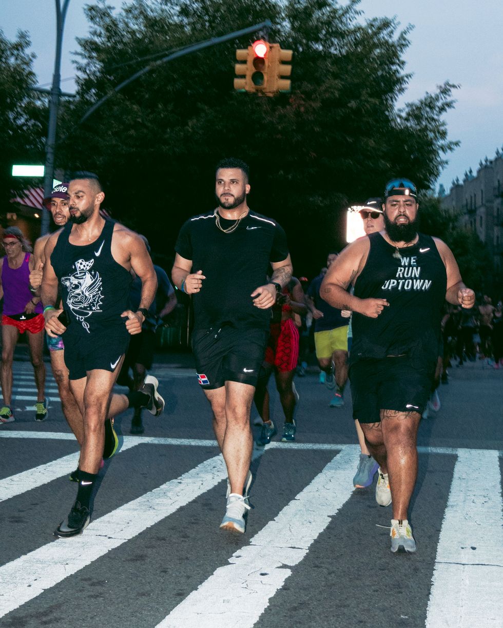 hector espinal and other runners on city street in nike and we run uptown gear